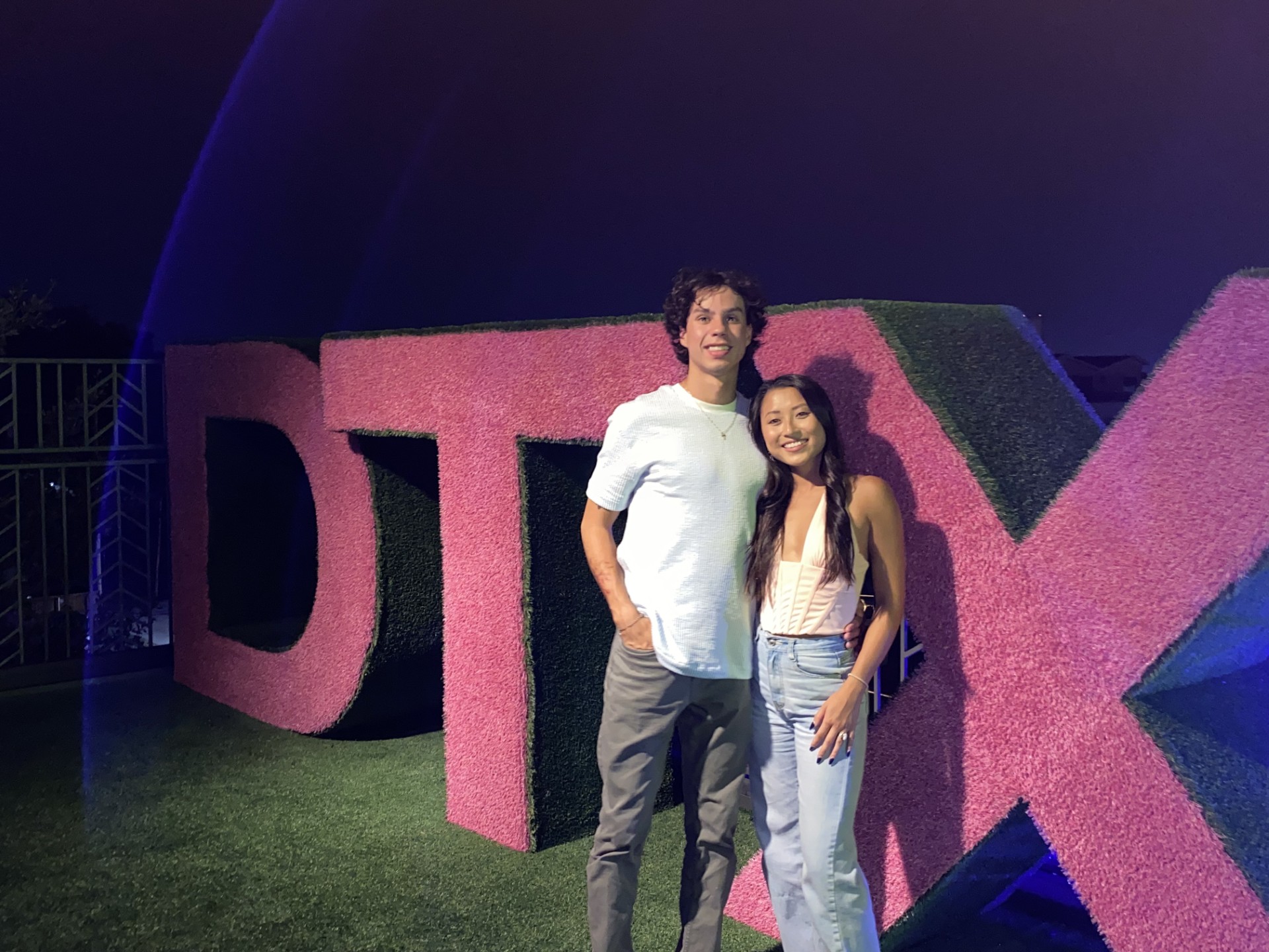 Emily and Matthew in front of the Dallas sign during Matthew's first visit